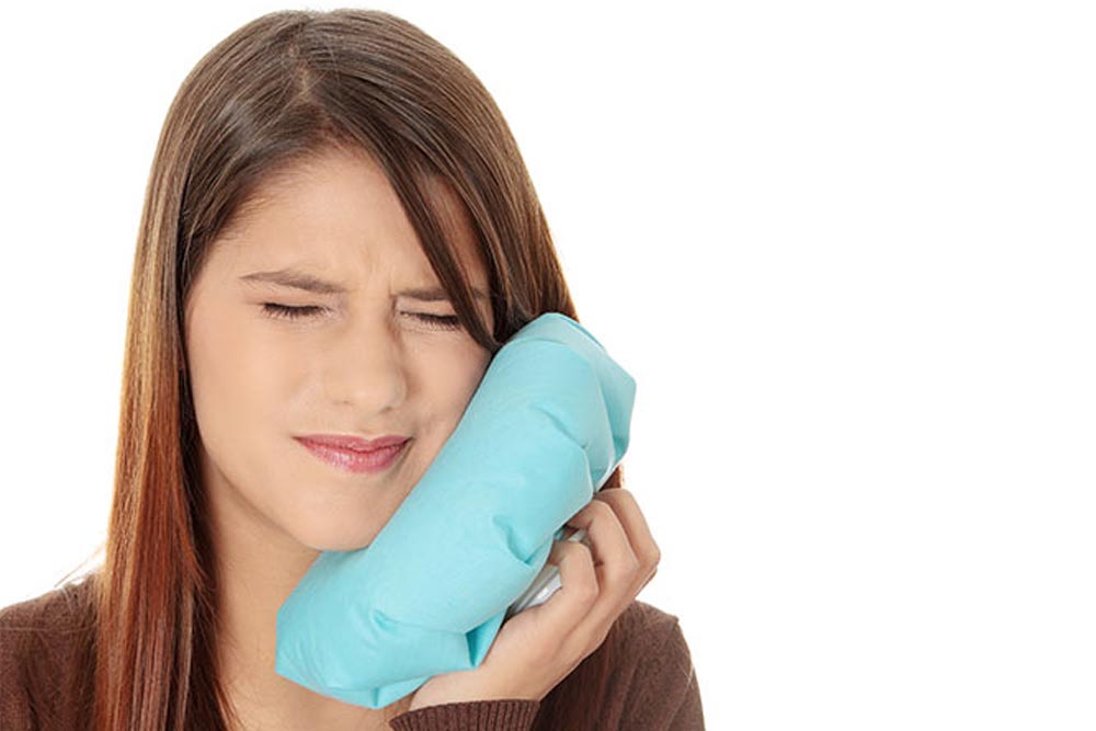 Beautiful girl suffering from toothache