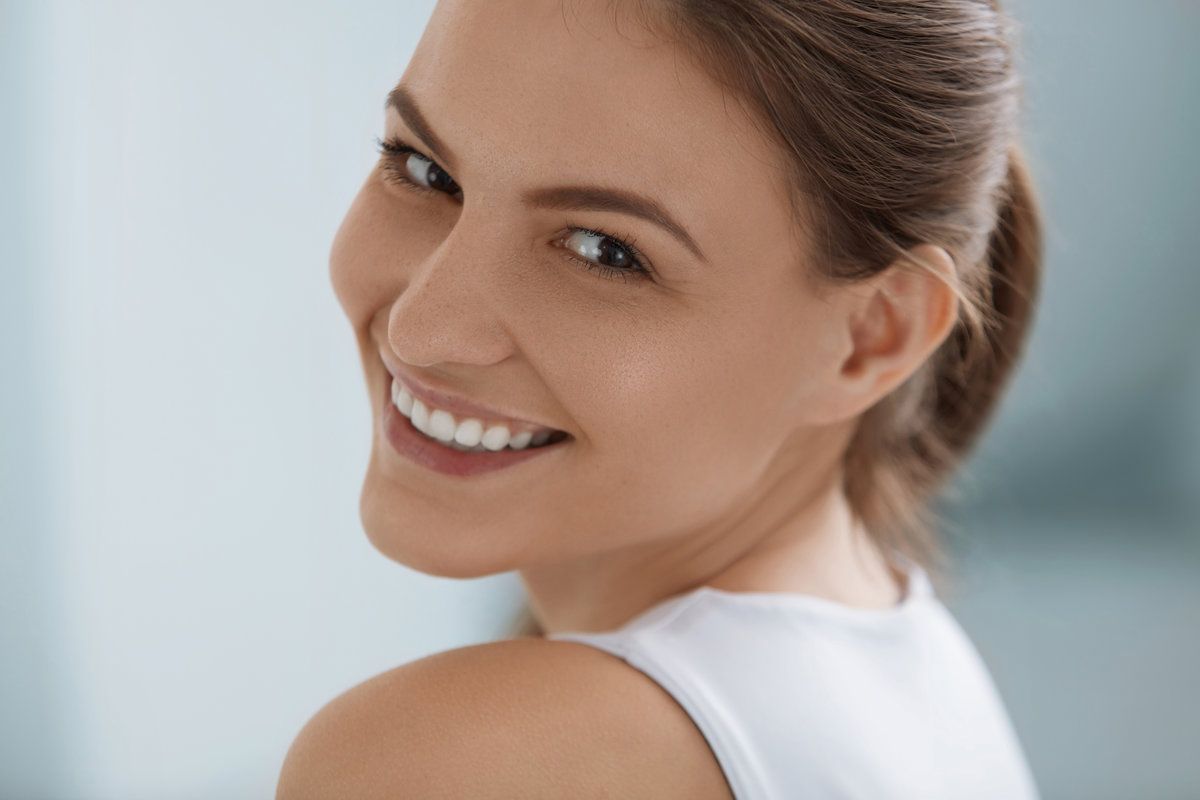 Smiling woman looking over her shoulder