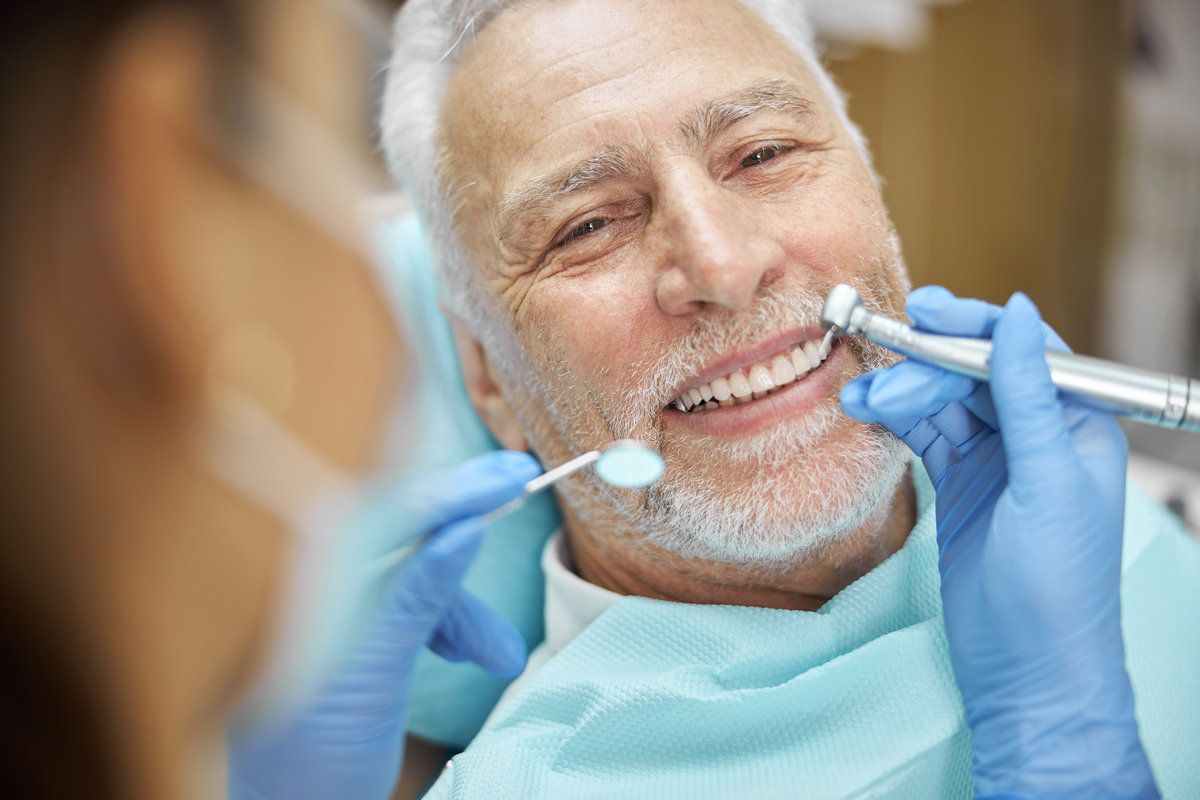 Smiling older man during a dental check up