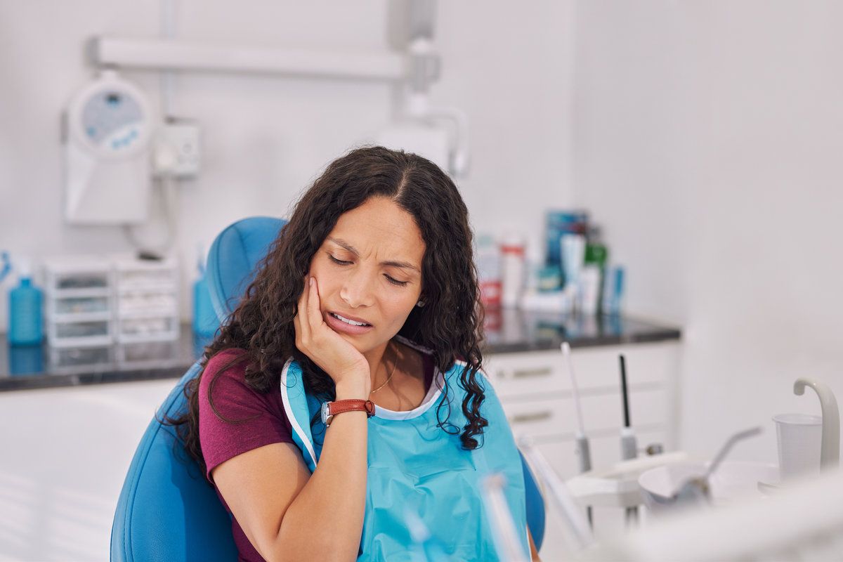 Young multiethnic woman suffering from toothache